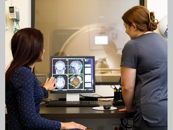 professionals reviewing brain scans