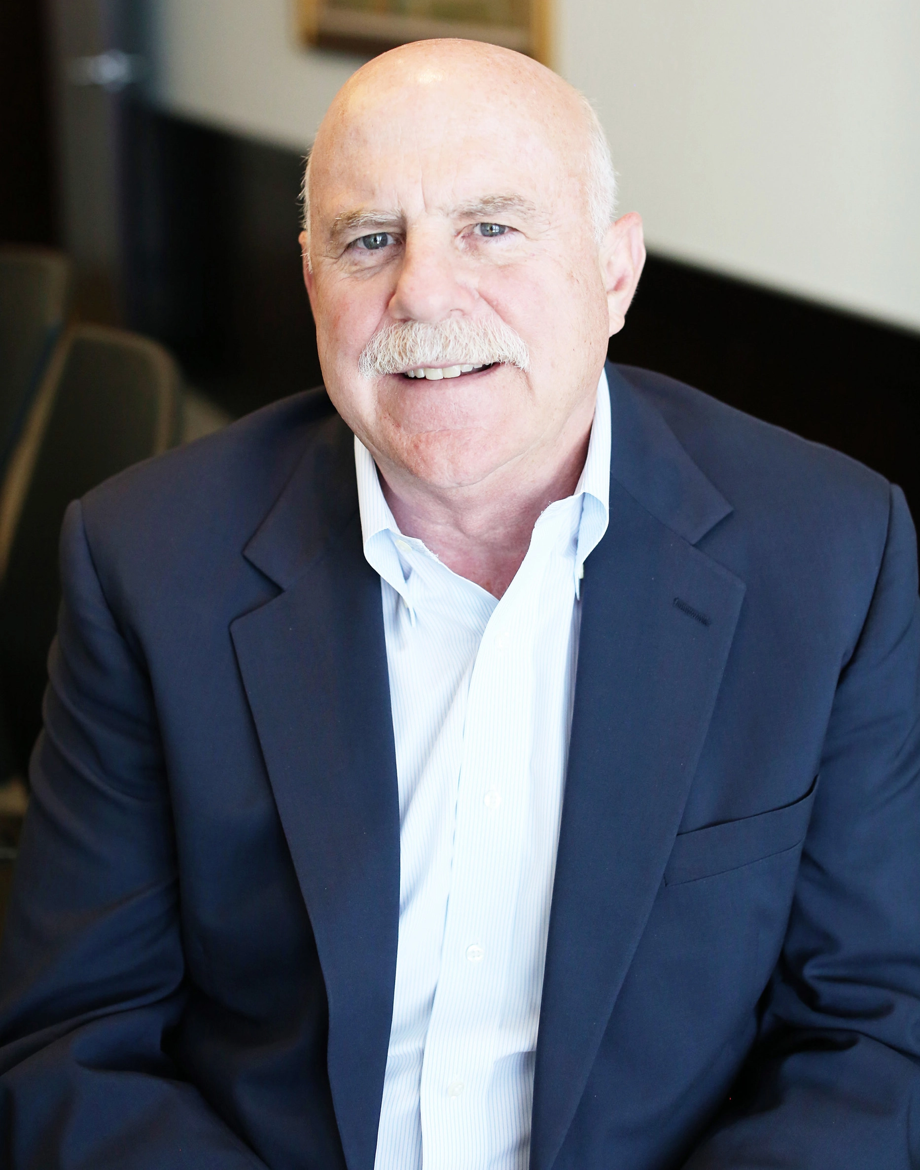 man in suit poses for portrait