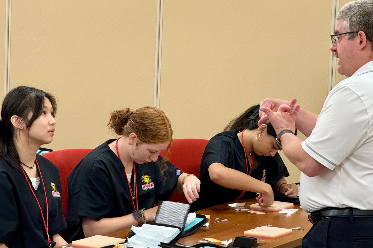 Clinical Director Bill Reynolds teaching suturing