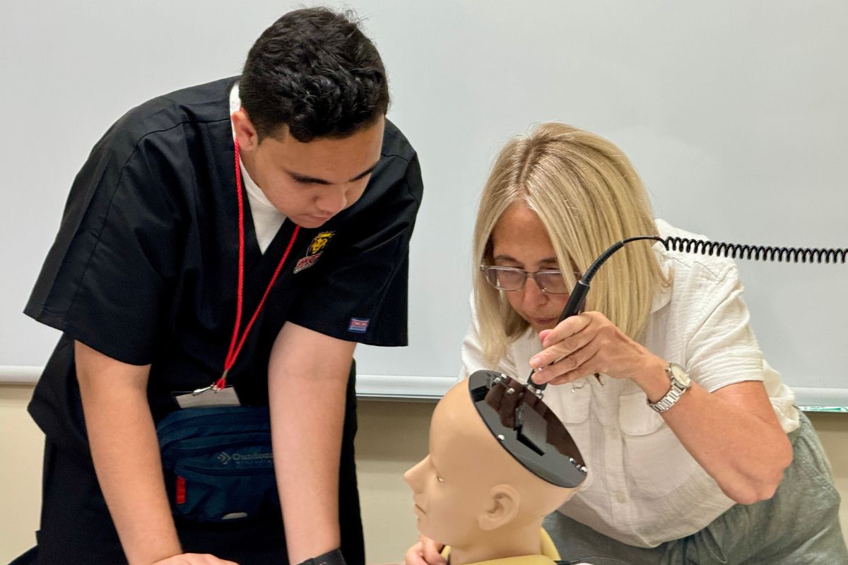 PA Program Director Diana Easton teaching patient examinations