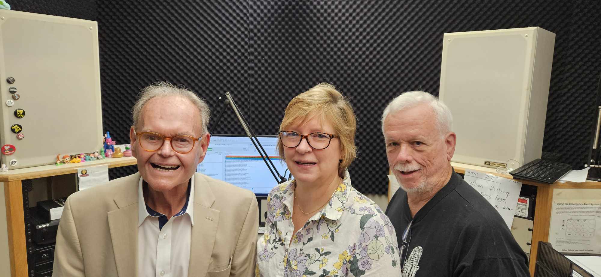 • (L-R) David Yonki, Sue Henry, and Pat Fadden celebrate 50 years of “The Radio Home Visitor”