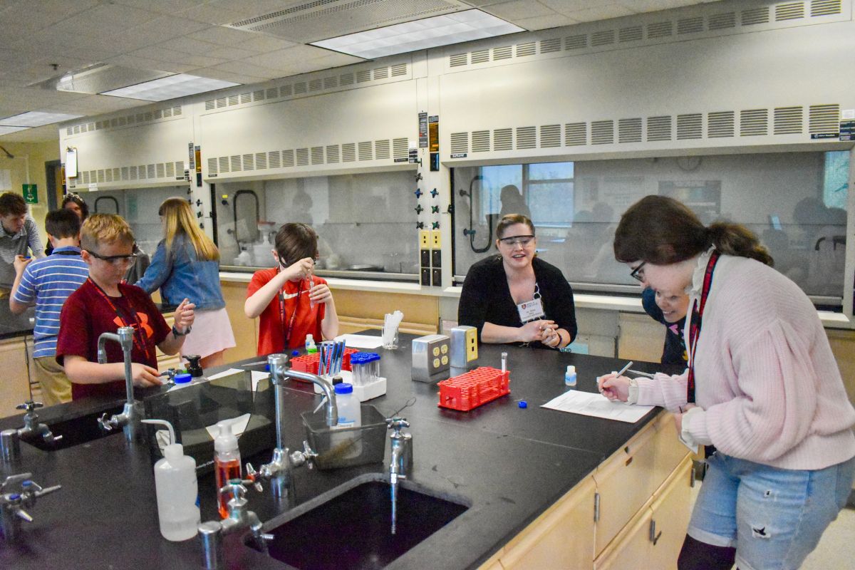 Dr. Heiss of the PRIMES team with local students at the King's College STEM Symposium in April 2024