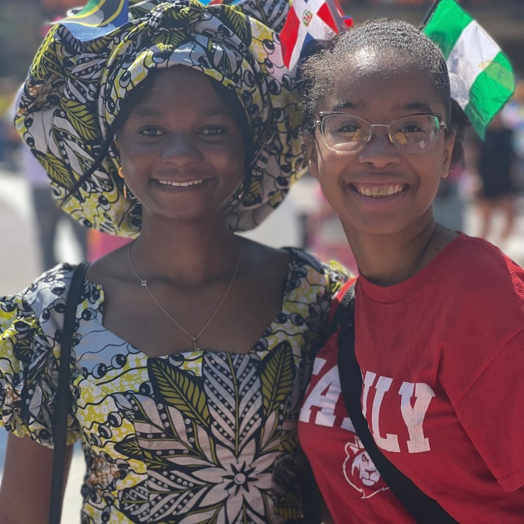 Two students standing side by side