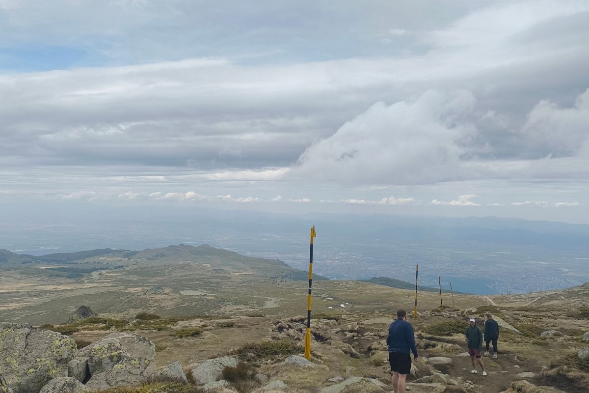 individuals walking down the mountain
