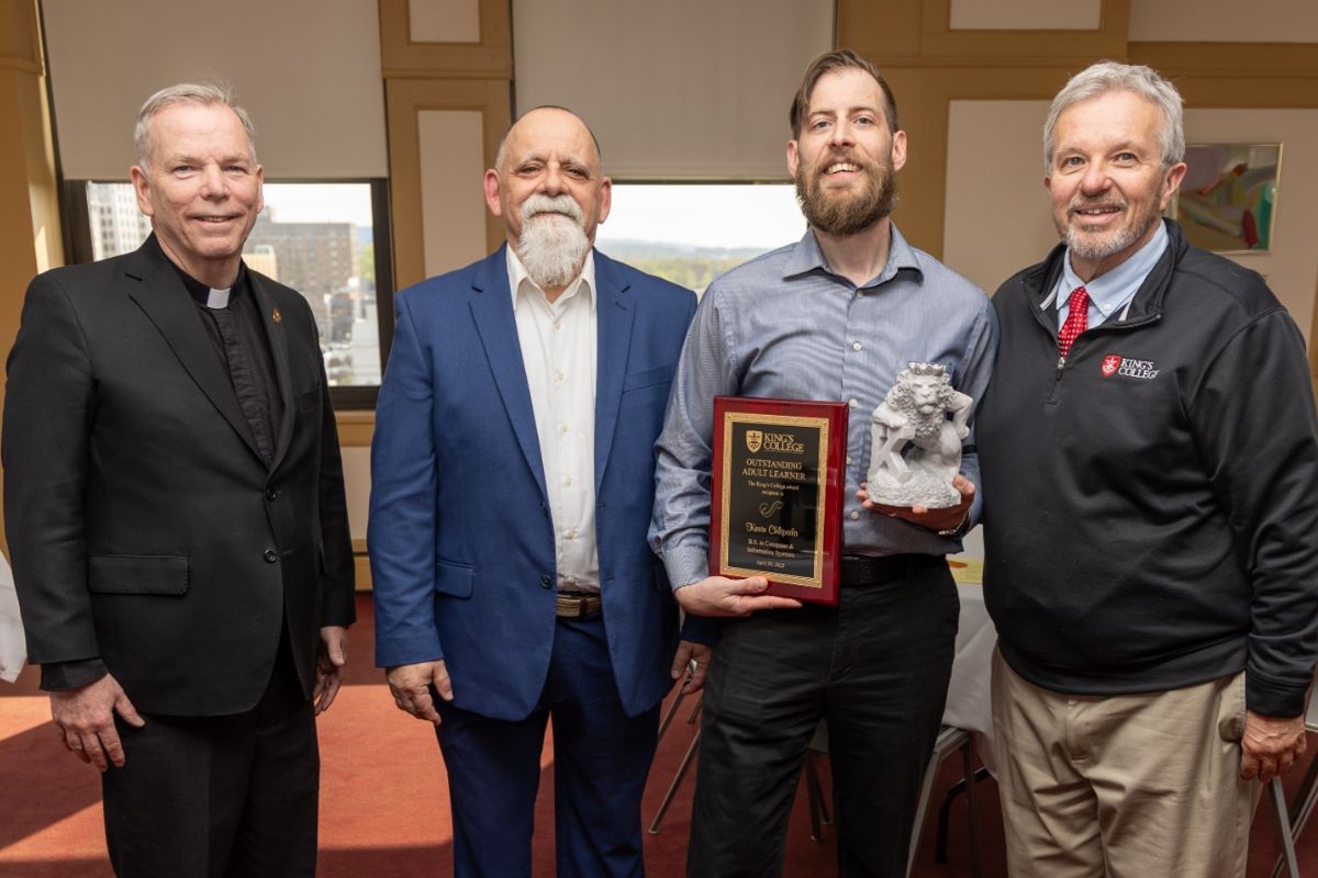 (from left to right) Rev. Thomas P. Looney, president of King’s College, Paul Moran, chief information officer, Kevin Chlipala, outstanding adult learner 2026, and Louis Palmeri, academic advisor for part-time students. 